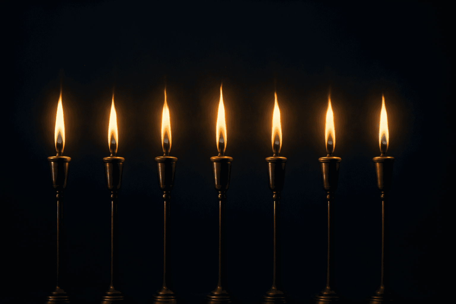 Seven separate golden flames burning in a row against deep darkness, the seven lampstands of Revelation, Christ present among his churches.